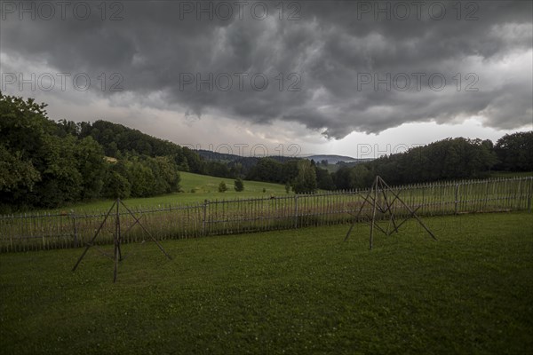 Rainy weather with meadow and farm