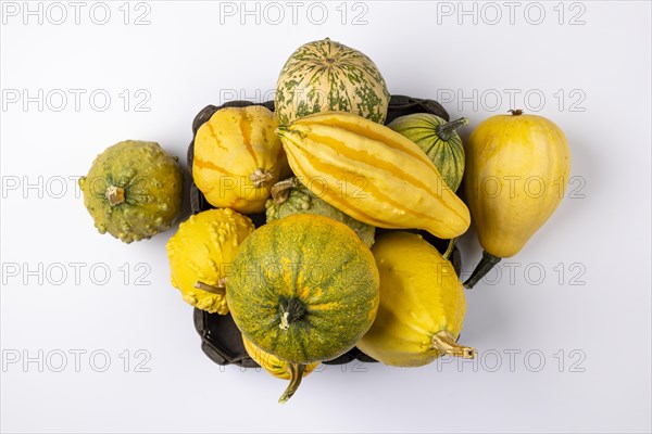 Various ornamental pumpkins in and next to baskets