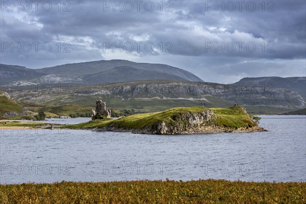 16th century Ardvreck Castle ruins at Loch Assynt in the Highlands at sunset