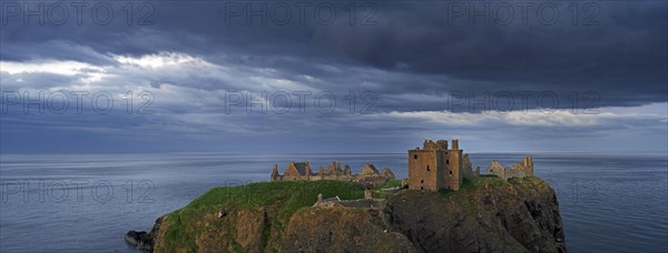 Menacing dark clouds above Dunnottar Castle