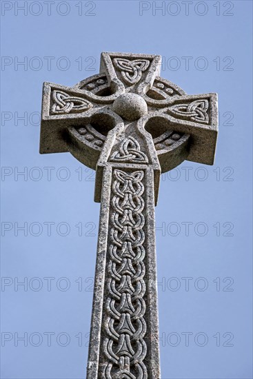 Monument with Celtic cross commemorating the Massacre of the Clan MacDonald of Glencoe in 1692