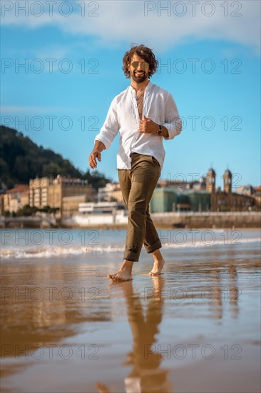 Summer lifestyle with a young dark-haired Caucasian man with long beard
