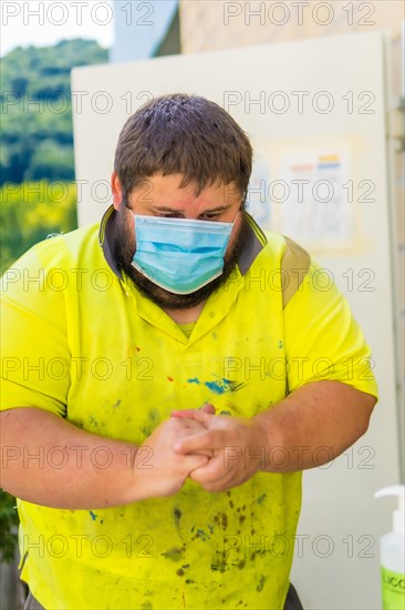 Worker in a recycling factory or clean point and garbage with a face mask and with security protections