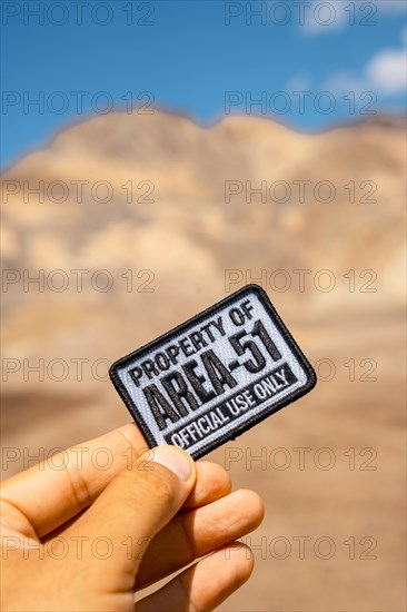 A young man with a patch for Area 51 clothing on Artist's Drive in Death Valley