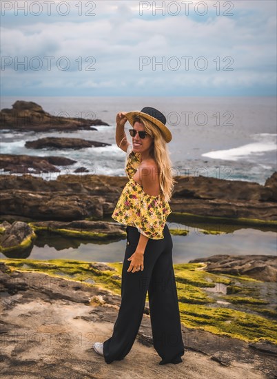 Caucasian blonde girl in a floral shirt