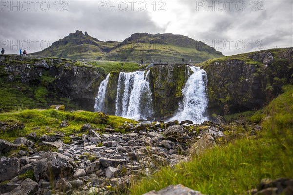 The famous Icelandic mountain Kirkjufell and the small waterfalls