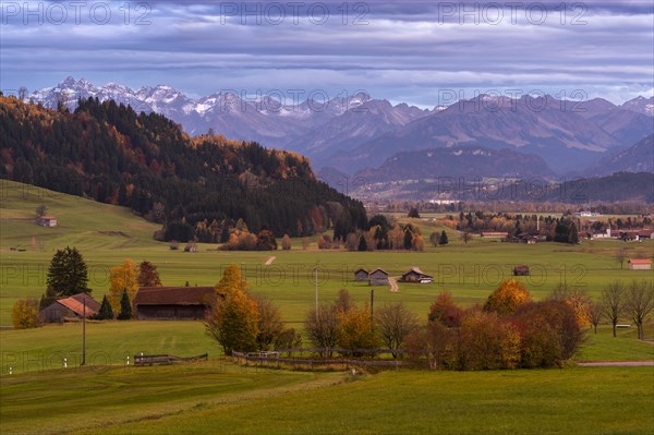 Landscape in the Allgaeu in autumn near Rettenberg with a view of farms