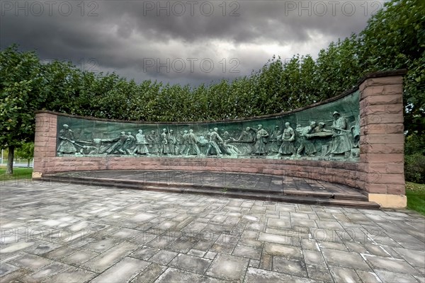 Dark clouds over crucible casting monument Monument for production of steel crucible steel in the form of panorama semicircle by sculptor Artur Hoffmann from 1952 for steel workers of Krupp Stahlwerke...