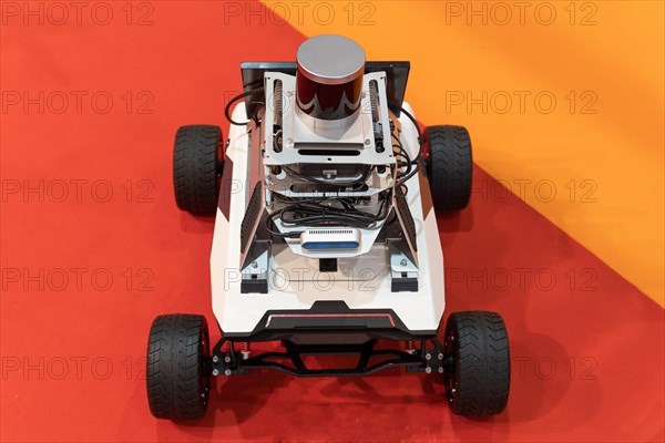 Driverless electric self-driving robot at the expo. Mid shot