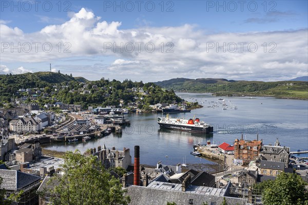 View over the harbour town of Oban to the ferry harbour with the ferry Isle of Lewis operating between Oban and Isle of Barra
