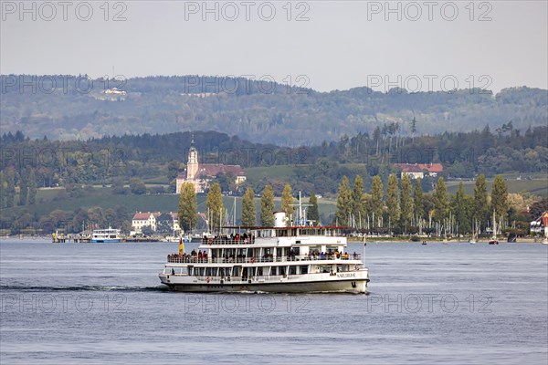 Excursion boat KARLSRUHE underway on Lake Constance against the backdrop of Birnau Monastery