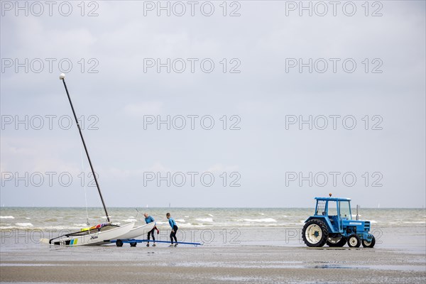 Tractor for transporting small sailboats on the beach