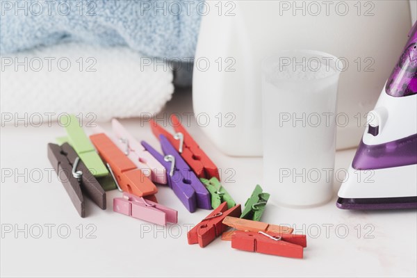 Close up detergent cup with pegs