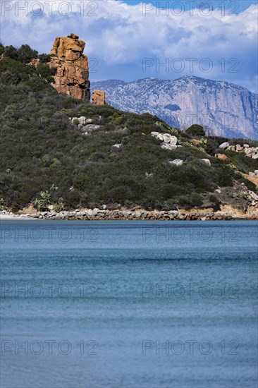 Landscape with red rocks and bright blue sea
