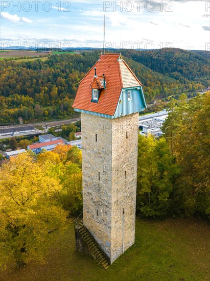 Historic tower in the autumn forest
