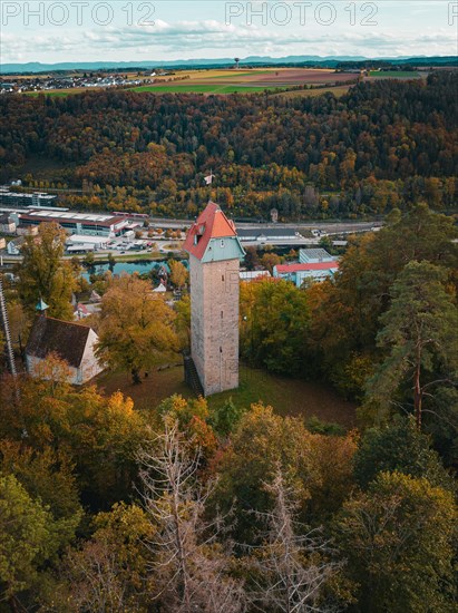 Historic tower in the autumn forest