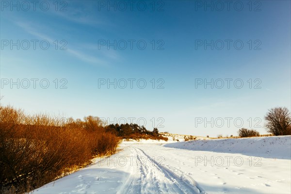 Diminishing perspective ski track snowy landscape against blue sky
