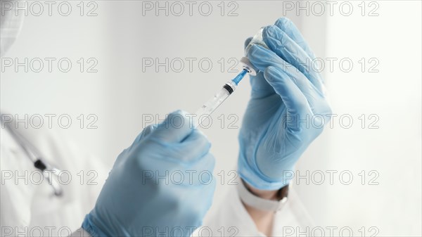 Doctor getting ready vaccine patient