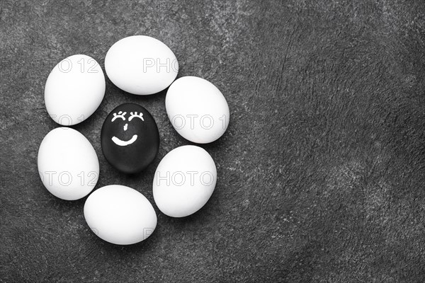 Flat lay different colored eggs with faces black lives matter movement copy space