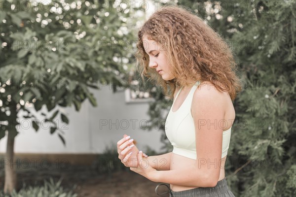Side view female athlete having wrist pain