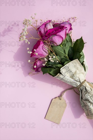 Bouquet roses wrapped music sheet