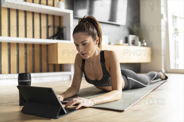 Full shot woman mat with tablet