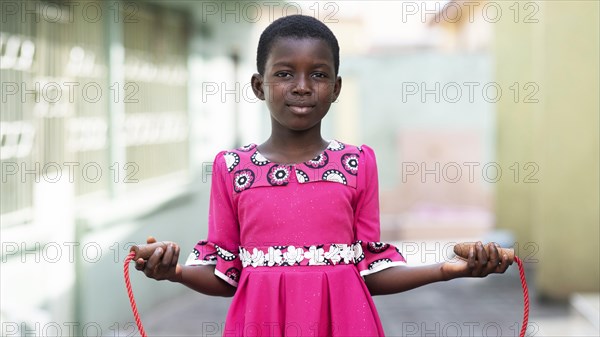 Medium shot kid holding jumping rope