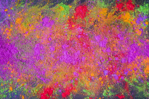 Scattered purple powder dark table