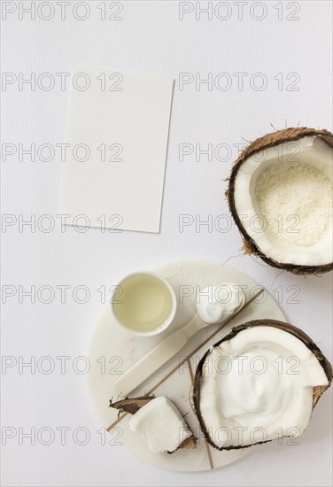 Top view cosmetic with coconut blank card white surface