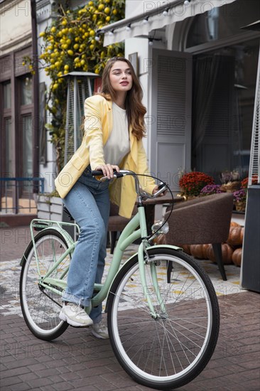 Beautiful woman with her bike street