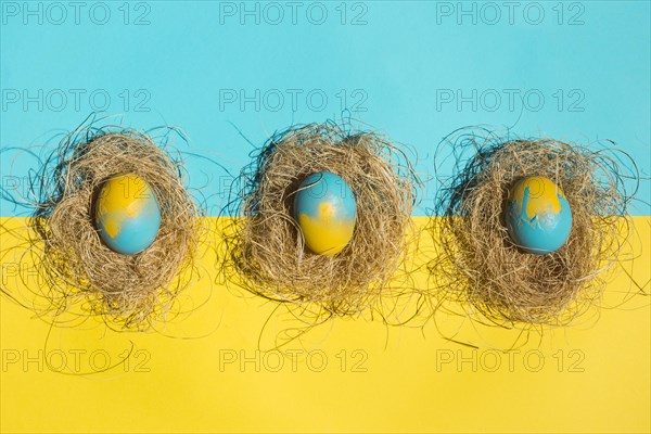 Easter eggs nests bright table