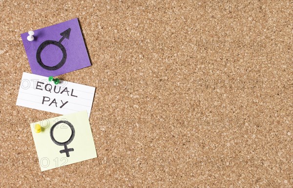 Equal pay man woman gender symbols copy space