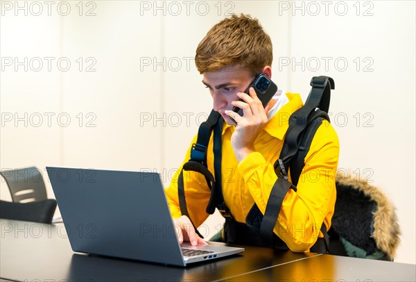 Employee with an exoskeleton from a futuristic high-tech warehouse