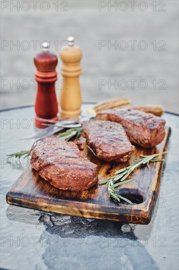 Grilled New York strip steaks outdoor