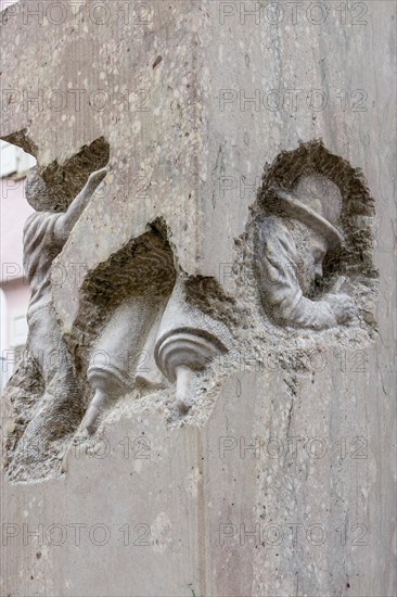 Detail with a carved stone figure on a stone column from the monument Jewish Life in Rottenburg by the artist Ralf Ehmann Eskefen