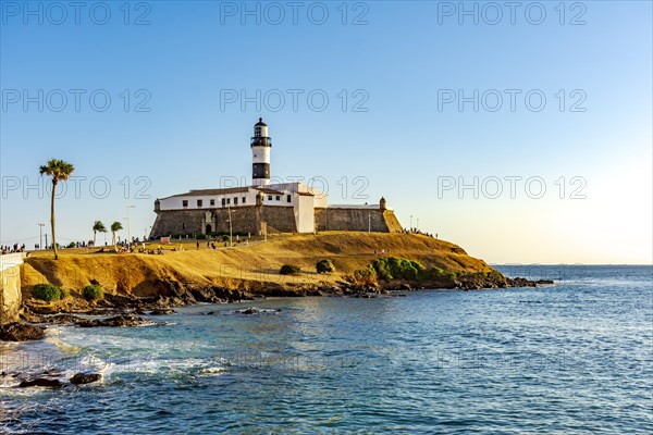 Sunset at the famous Farol da Barra in the city of Salvador