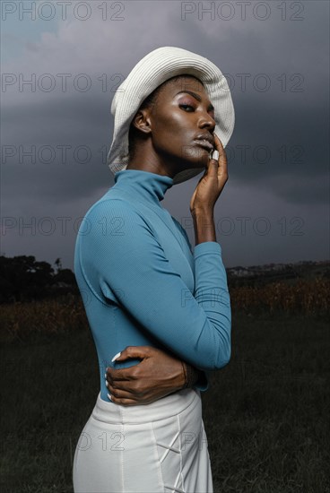 Portrait young woman posing with hat