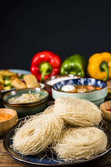 Rice vermicelli plate with thai traditional food against black background