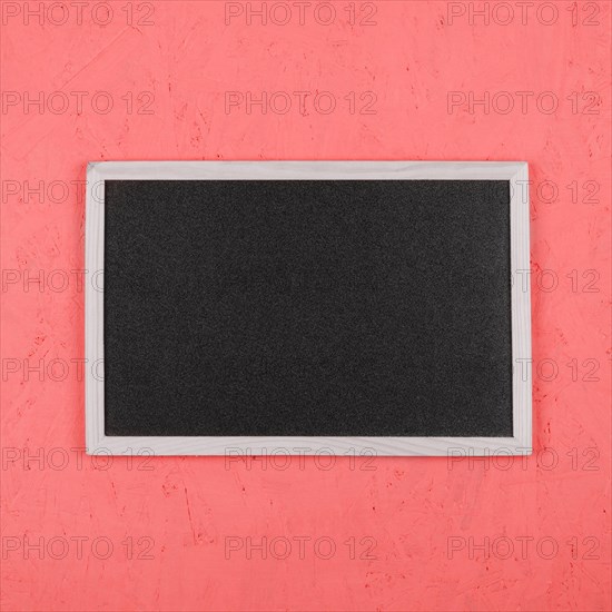 Small blank blackboard coral painted wall