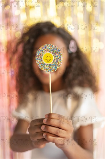 Young pretty girl festive party with lollipop