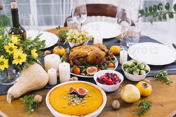 Festive table with baked chicken vegetables