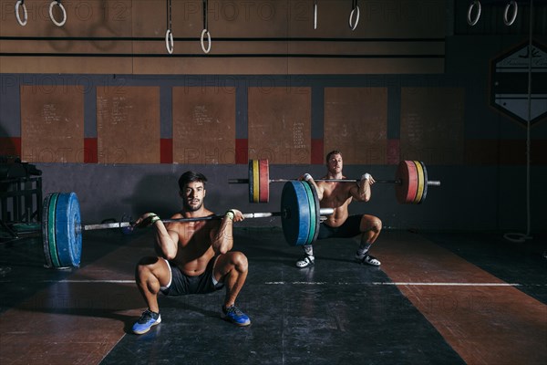 Men doing bodybuilding