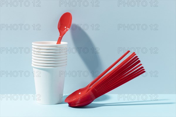 Red small spoons plastic cups