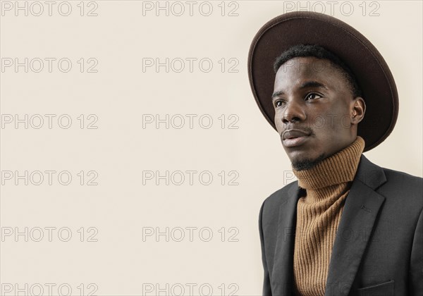 Young handsome man posing with hat 6