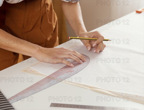 Close up hands with ruler pencil