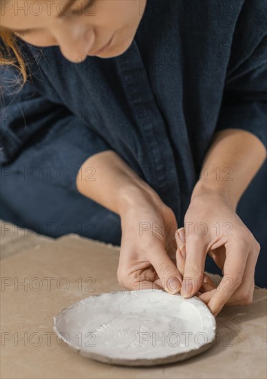 Close up woman making plate