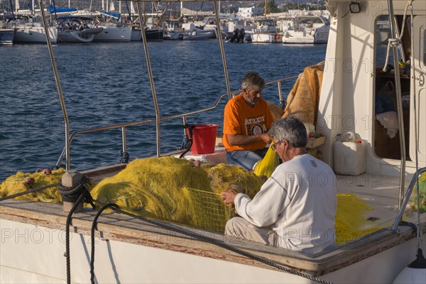 Fishermen mending nets