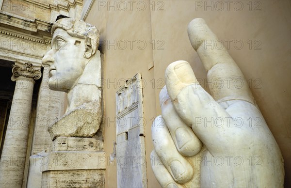 Colossal hand with index finger and head