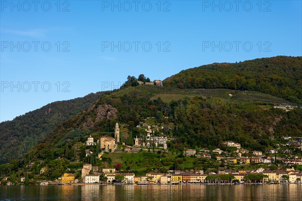 Beautiful Village Morcote witha Chucrh and Castle on Lake Lugano and Mountainscape with blue Clear sky in Morcote