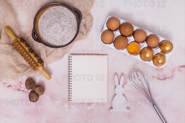Gold easter eggs rack with notebook kitchen utensils rabbit